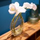 Real touch lillies looped stem vase with faux water 50cm