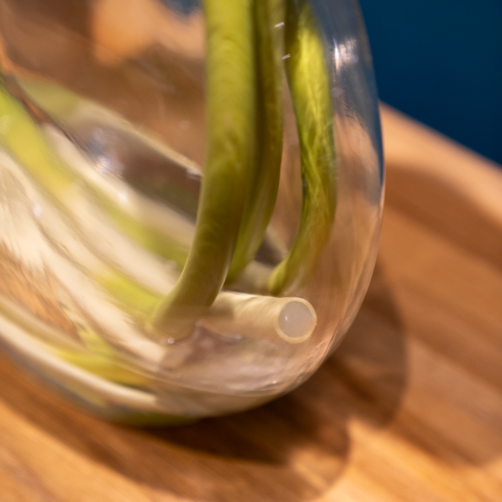 Real touch lillies looped stem vase with faux water 50cm